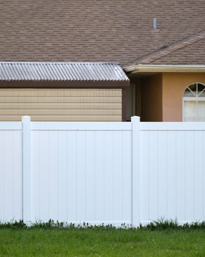 White plastic fence for back yard protection and privacy